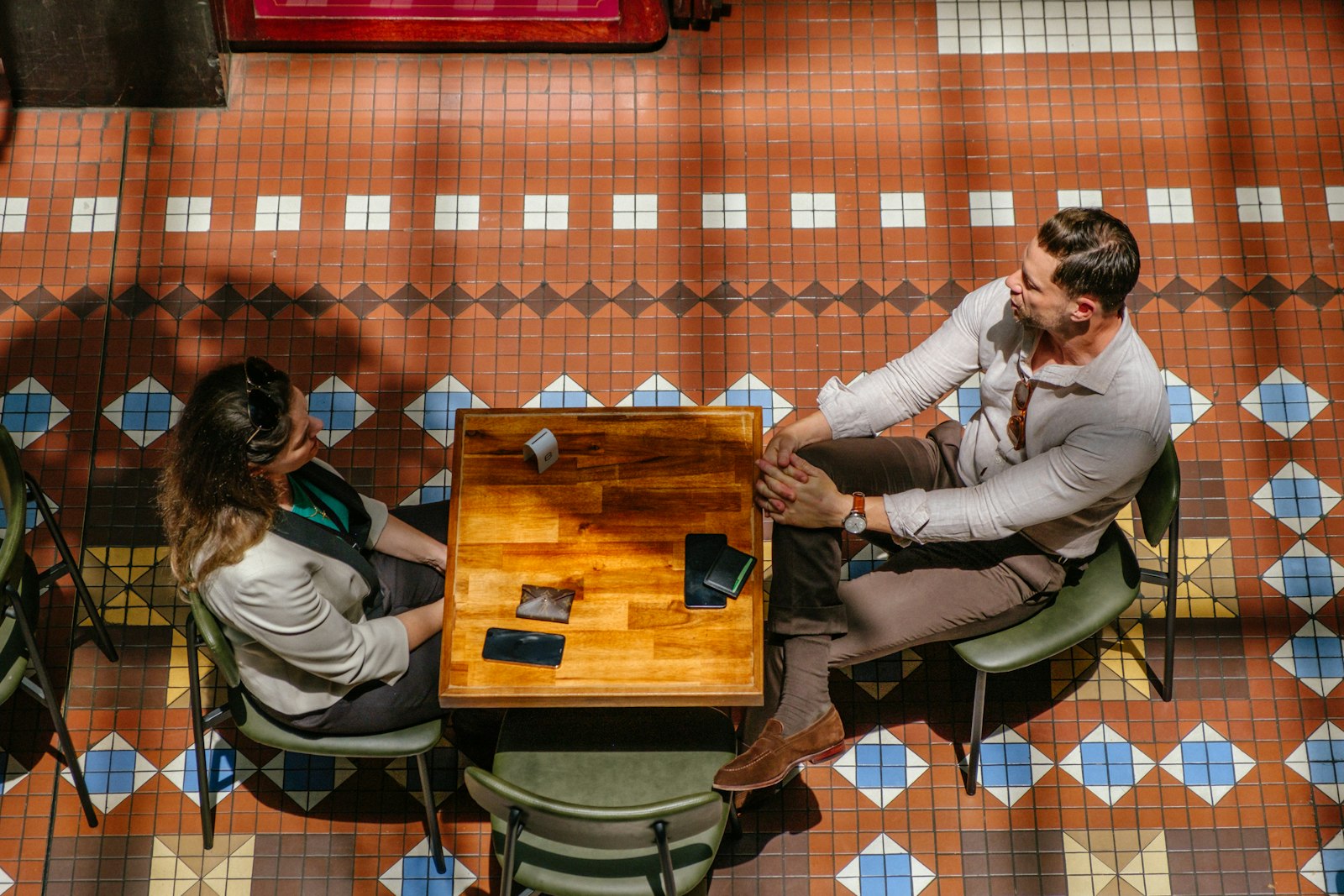 Two people talking at a table